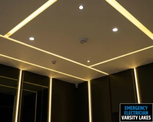 Ceiling with sleek, modern lighting featuring recessed spotlights and LED strips.